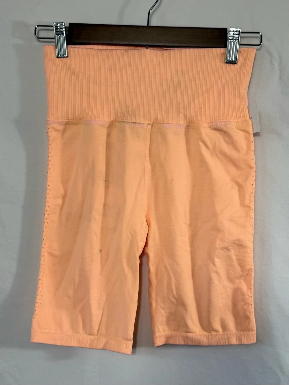 Free People Movement Good Karma Bike Shorts in a vibrant, peach-orange shade
